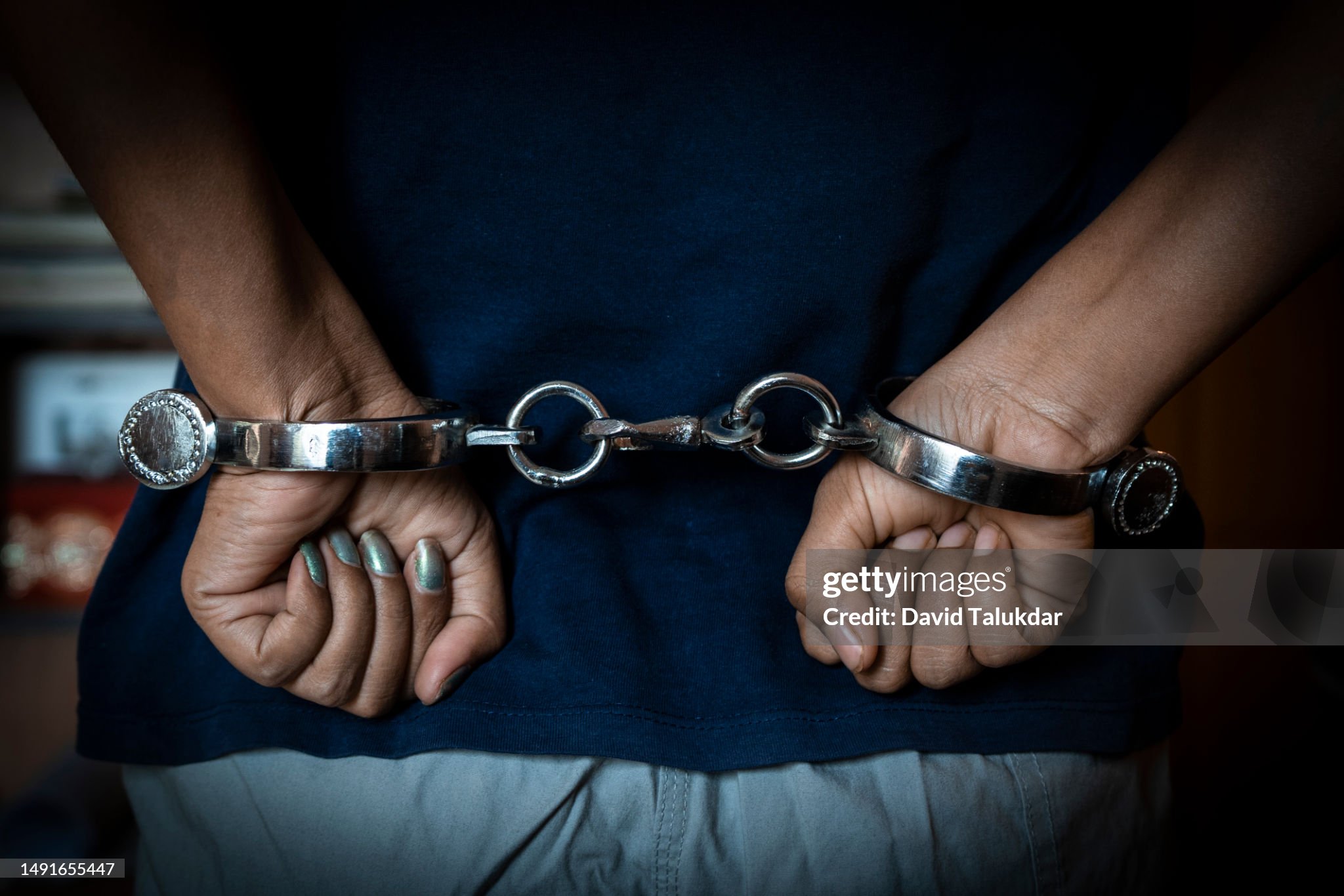 Woman hand with Indian handcuffs
