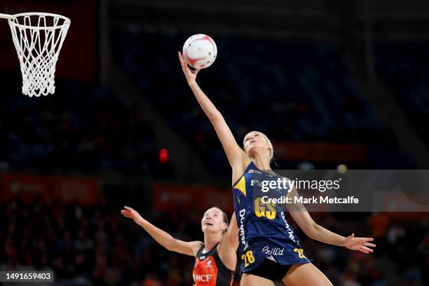 Charlie Bell of the Lightning catches a pass during the round 10 Super Netball match between Giants Netball and Sunshine Coast Lightning at Ken...