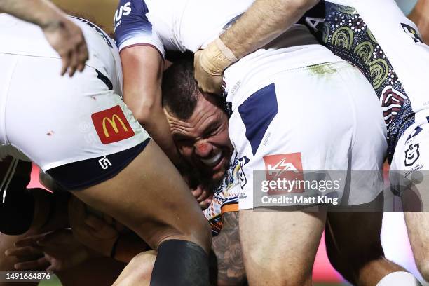 David Klemmer of the Tigers is tackled during the round 12 NRL match between Wests Tigers and North Queensland Cowboys at Leichhardt Oval on May 20,...