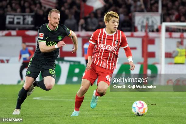 Ritsu Doan of SC Freiburg in action during the Bundesliga match between Sport-Club Freiburg and VfL Wolfsburg at Europa-Park Stadion on May 19, 2023...