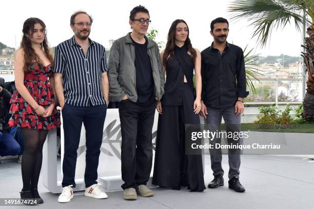 Ece Bagci, Deniz Celiloglu, Director Nuri Bilge Ceylan, Merve Dizdar and Musab Ekici attend the "Kuru Otlar Ustune " photocall at the 76th annual...