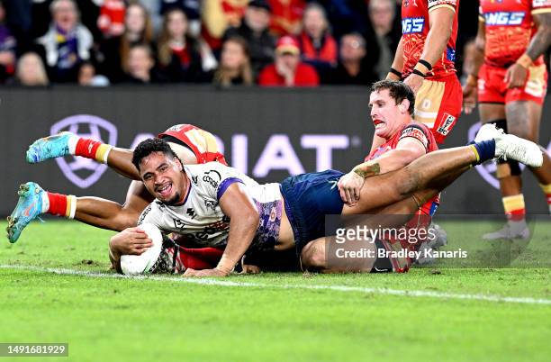 Eliesa Katoa of the Storm celebrates after scoring a try during the round 12 NRL match between Dolphins and Melbourne Storm at Suncorp Stadium on May...