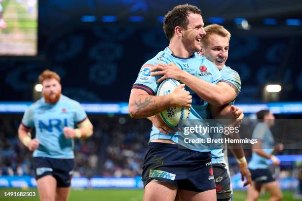 Dylan Pietsch of the Waratahs celebrates scoring a try with team mates during the round 13 Super Rugby Pacific match between NSW Waratahs and Fijian...