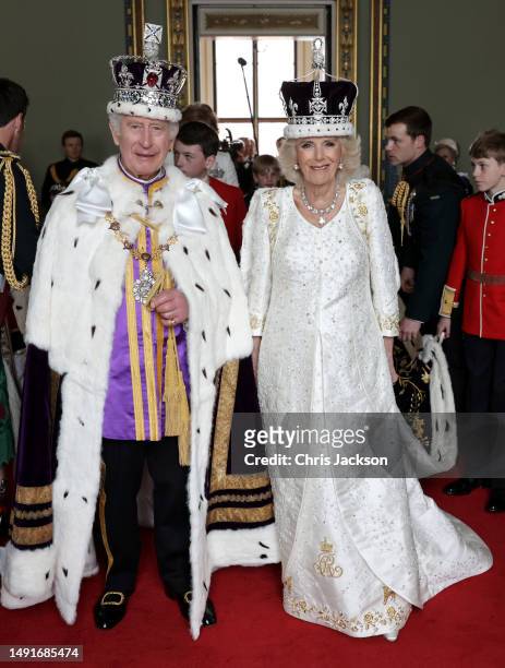 King Charles III and Queen Camilla pose and smile after their Coronation, at Buckingham Palace on May 06, 2023 in London, England.