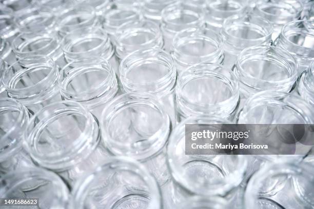 glass jars, abstract background. - ecoponto de reciclagem de garrafas imagens e fotografias de stock