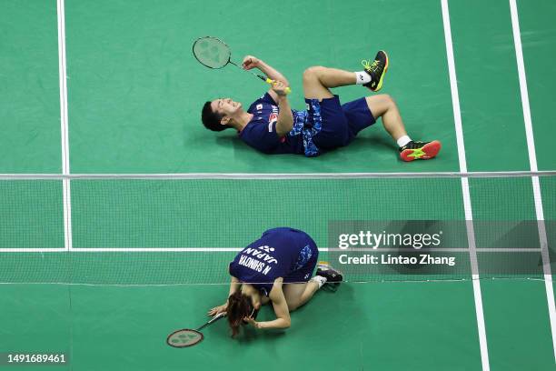 Kyohei Yamashita and Naru Shinoya of Japan celebrate the victory after compete in the Mixed Doubles Semifinal match against Feng Yanzhe and Huang...