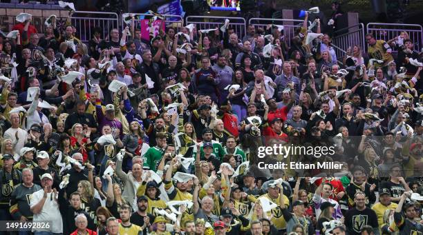 Fans wave towels in the third period of Game One of the Western Conference Final of the 2023 Stanley Cup Playoffs at T-Mobile Arena between the...