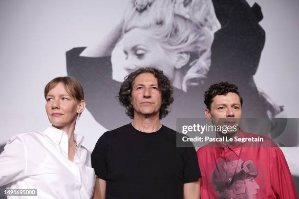 Sandra Hüller, director Jonathan Glazer and Christian Friedel attend "The Zone of Interest" press conference at the 76th annual Cannes film festival...