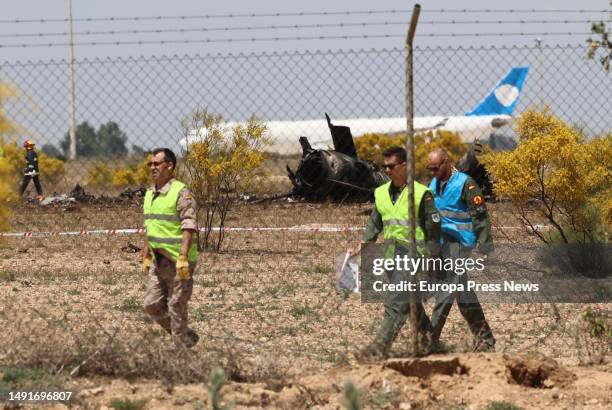 Operators around the wreckage of the Air Force F-18 aircraft that crashed this morning at the Zaragoza air base, on 20 May, 2023 in Zaragoza, Aragon,...