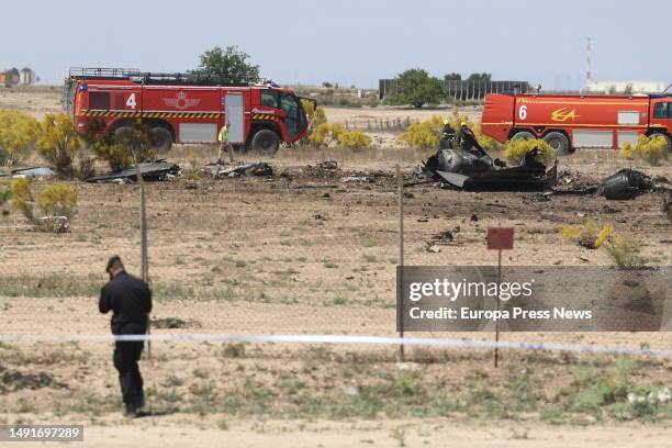 Air Force firefighting cars around the wreckage of the Air Force F-18 aircraft that crashed this morning at the Zaragoza air base, on 20 May, 2023 in...