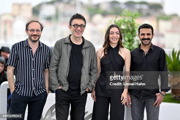 Deniz Celiloglu, Director Nuri Bilge Ceylan, Merve Dizdar and Musab Ekici attend the "Kuru Otlar Ustune " photocall at the 76th annual Cannes film...