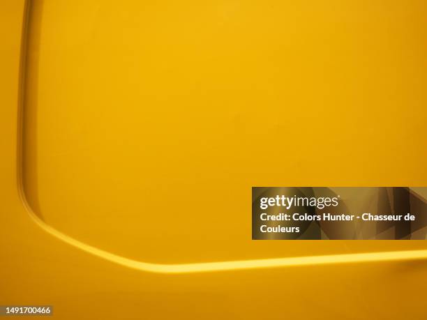 close-up of the body of a dark yellow van in paris, france - car crash wall stock pictures, royalty-free photos & images