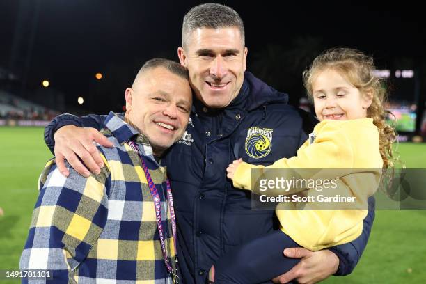 Nick Montgomery coach of the Mariners with his daughter and Mainers owner Richard Peil during the second leg of the A-League Men's Semi Final between...