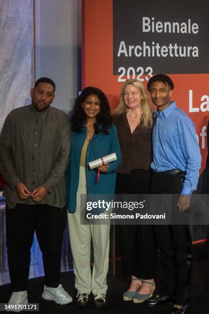 Participants of the Great Britain pavilion titled 'Dancing Before the Moon' pose for a portrait after receiving the special mention for National...