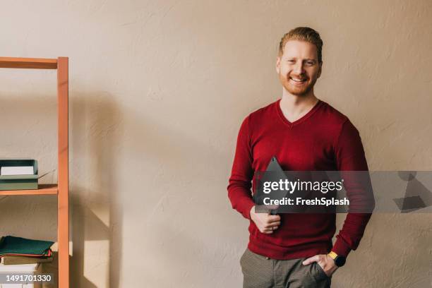 a portrait of a happy handsome blond businessman with a tablet - coach drawing board stock pictures, royalty-free photos & images