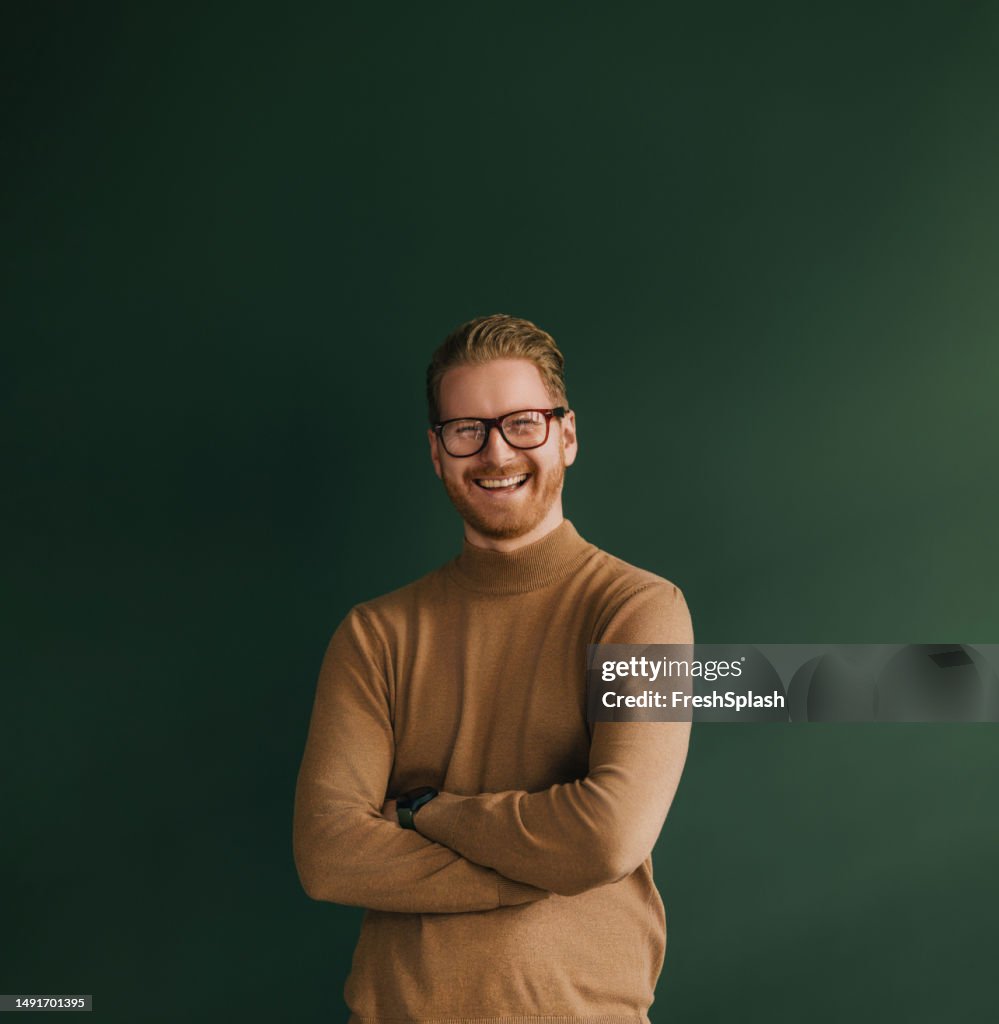 A Happy Handsome Blond Businessman With Glasses Looking At Camera