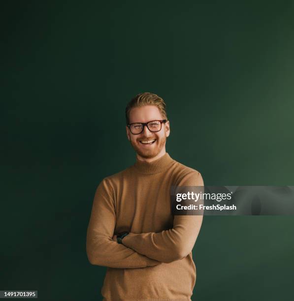 a happy handsome blond businessman with glasses looking at camera - smart studio shot stock pictures, royalty-free photos & images