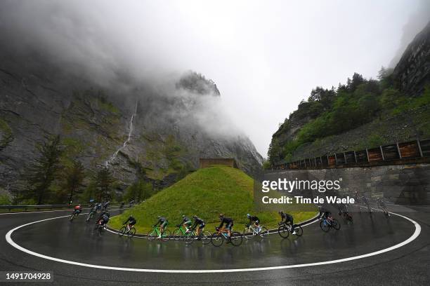 General view of the peloton compete racing down the to the Simplon Pass - Passo del Sempione during the 106th Giro d'Italia 2023, Stage 14 a 194km...