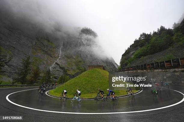 General view of the peloton compete racing down the to the Simplon Pass - Passo del Sempione during the 106th Giro d'Italia 2023, Stage 14 a 194km...