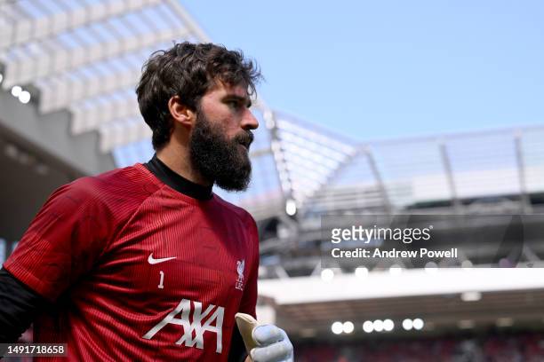 Alisson Becker of Liverpool during the warm up before the Premier League match between Liverpool FC and Aston Villa at Anfield on May 20, 2023 in...