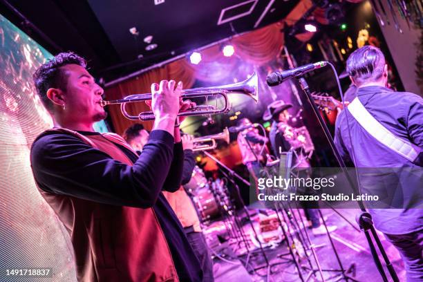 musician man playing trumpet in a music concert - country concert stock pictures, royalty-free photos & images