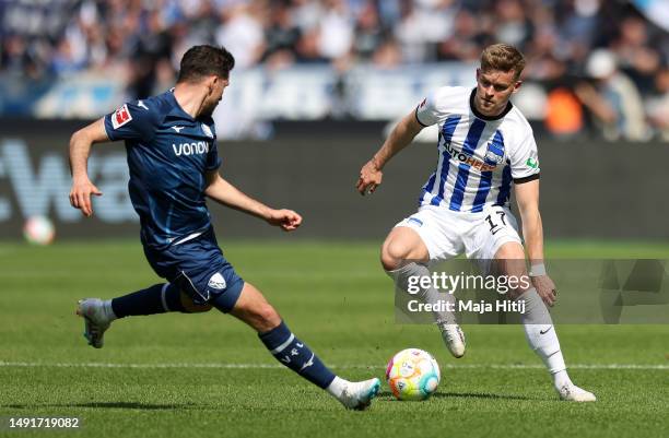 Kevin Stoeger of VfL Bochum 1848 is put under pressure by Maximilian Mittelstaedt of Hertha Berlin during the Bundesliga match between Hertha BSC and...