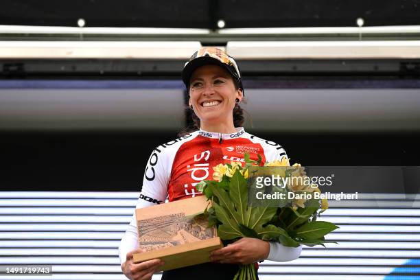 Morgane Coston of France and Team Cofidis celebrates at podium as most combative rider trophy winner during the 8th Vuelta a Burgos Feminas 2023,...