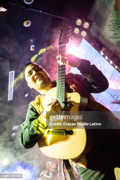 portrait of a musician man playing guitar in a music concert - country concert stock pictures, royalty-free photos & images