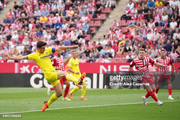 Gerard Moreno of Villarreal CF scores the team's second goal during the LaLiga Santander match between Girona FC and Villarreal CF at Montilivi...