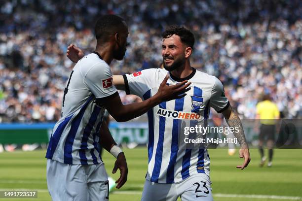 Dodi Lukebakio of Hertha Berlin celebrates with teammate, Marco Richter, after scoring the team's first goal which is later disallowed, during the...