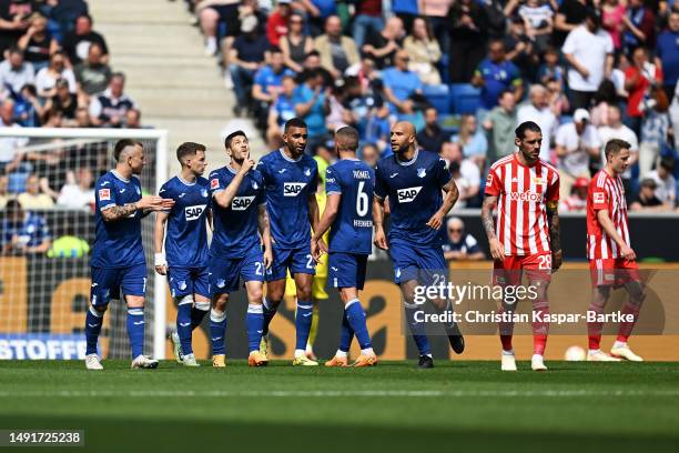 Andrej Kramaric of TSG Hoffenheim celebrates with teammates after scoring the team's second goal from a penalty kick during the Bundesliga match...