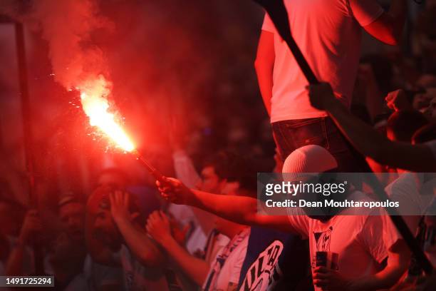 Schalke 04 fans show their support with flares during the Bundesliga match between FC Schalke 04 and Eintracht Frankfurt at Veltins-Arena on May 20,...