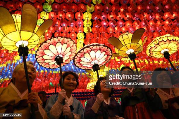 Buddhists gather under colorful lanterns during the Lotus Lantern Festival to celebrate the upcoming birthday of Buddha at the Jogyesa Temple on May...