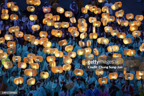Buddhists carry lanterns in a parade during the Lotus Lantern Festival to celebrate the upcoming birthday of Buddha on May 20, 2023 in Seoul, South...