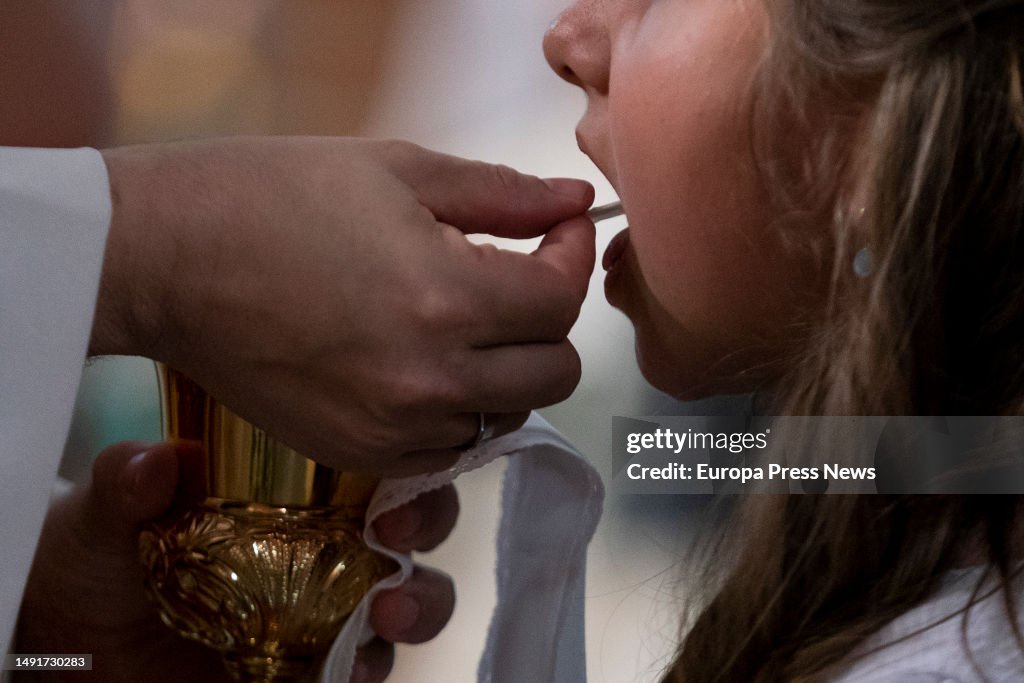 Celebration Of The First Communion In A Madrid School