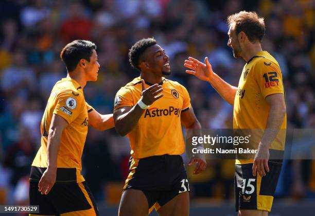 Hwang Hee-Chan of Wolverhampton Wanderers celebrates with teammates after scoring the team's first goal during the Premier League match between...