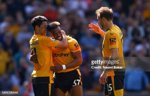 Hwang Hee-Chan of Wolverhampton Wanderers celebrates with teammates after scoring the team's first goal during the Premier League match between...