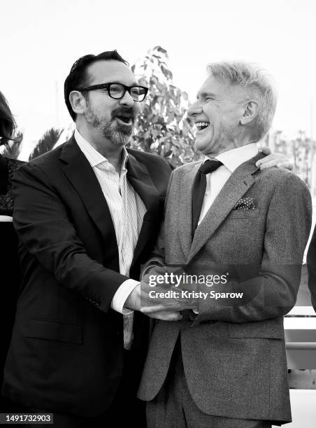 Director James Mangold and Harrison Ford attend the "Indiana Jones And The Dial Of Destiny" photocall at the 76th annual Cannes film festival at...