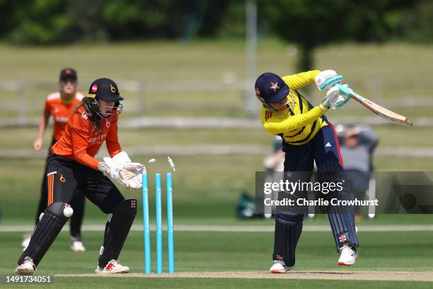 Sophia Dunkley of South East Stars is bowled out by Blaze's Sarah Glenn as wicket keeper Sarah Bryce looks on during the Charlotte Edwards Cup match...