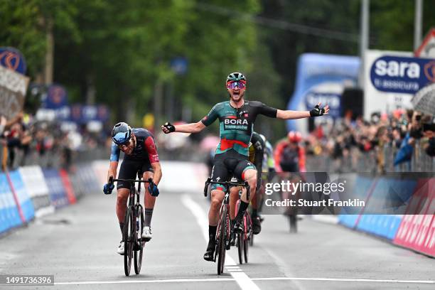 Nico Denz of Germany and Team BORA - hansgrohe celebrates at finish line as stage winner ahead of Derek Gee of Canada and Team Israel - Premier Tech...