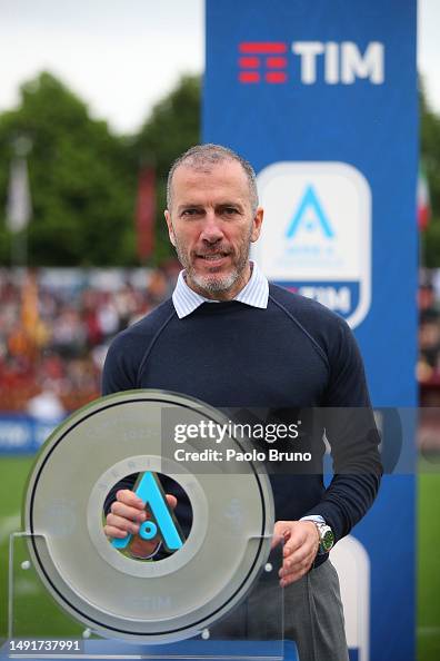 TIm Ceo Pietro Labriola poses with the trophy after AS Roma winning ...