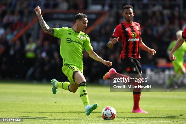 Antony of Manchester United runs with the ball whilst under pressure from Lloyd Kelly of AFC Bournemouth during the Premier League match between AFC...