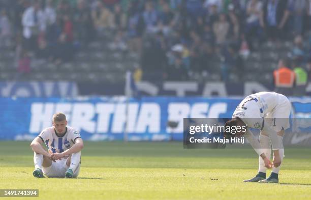 Marton Dardai and Marvin Plattenhardt of Hertha Berlin look dejected after the final whistle of the Bundesliga match between Hertha BSC and VfL...