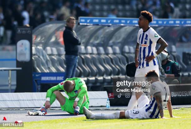 Oliver Christensen of Hertha Berlin and teammates look dejected after the final whistle of the Bundesliga match between Hertha BSC and VfL Bochum...