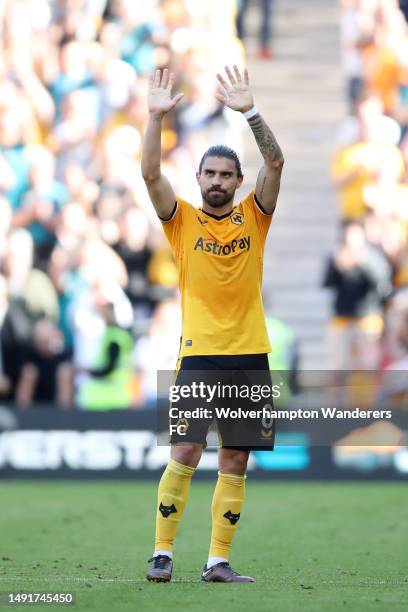 Ruben Neves of Wolverhampton Wanderers applauds the fans as they are substituted off during the Premier League match between Wolverhampton Wanderers...