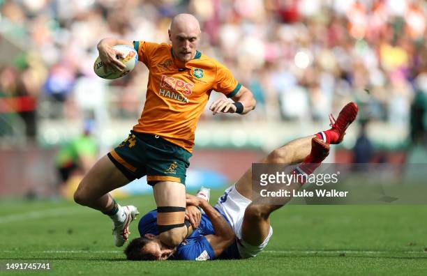 James Turner of Australia is tackled by Paulin Riva of France during The Pool C match between France and Australia during Day One of The HSBC London...