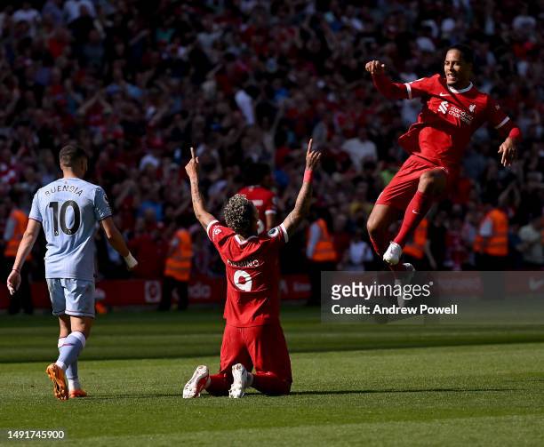 Roberto Firmino of Liverpool celebrates after scoring the equalising goal during the Premier League match between Liverpool FC and Aston Villa at...