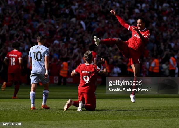 Roberto Firmino of Liverpool celebrates after scoring the equalising goal during the Premier League match between Liverpool FC and Aston Villa at...