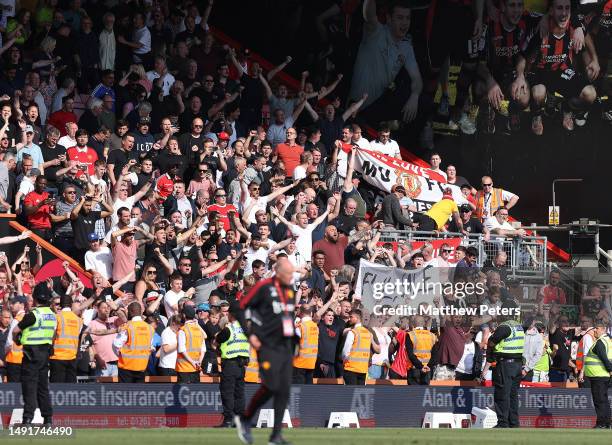 Manchester United fans celebrate after the Premier League match between AFC Bournemouth and Manchester United at Vitality Stadium on May 20, 2023 in...