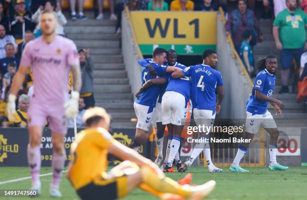 Yerry Mina of Everton celebrates with teammates after scoring the team's first goal during the Premier League match between Wolverhampton Wanderers...